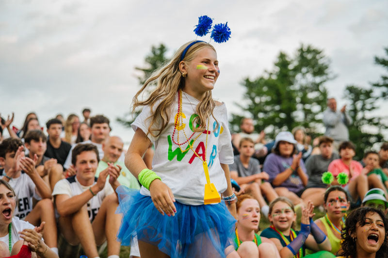 Girl having fun with campers in background